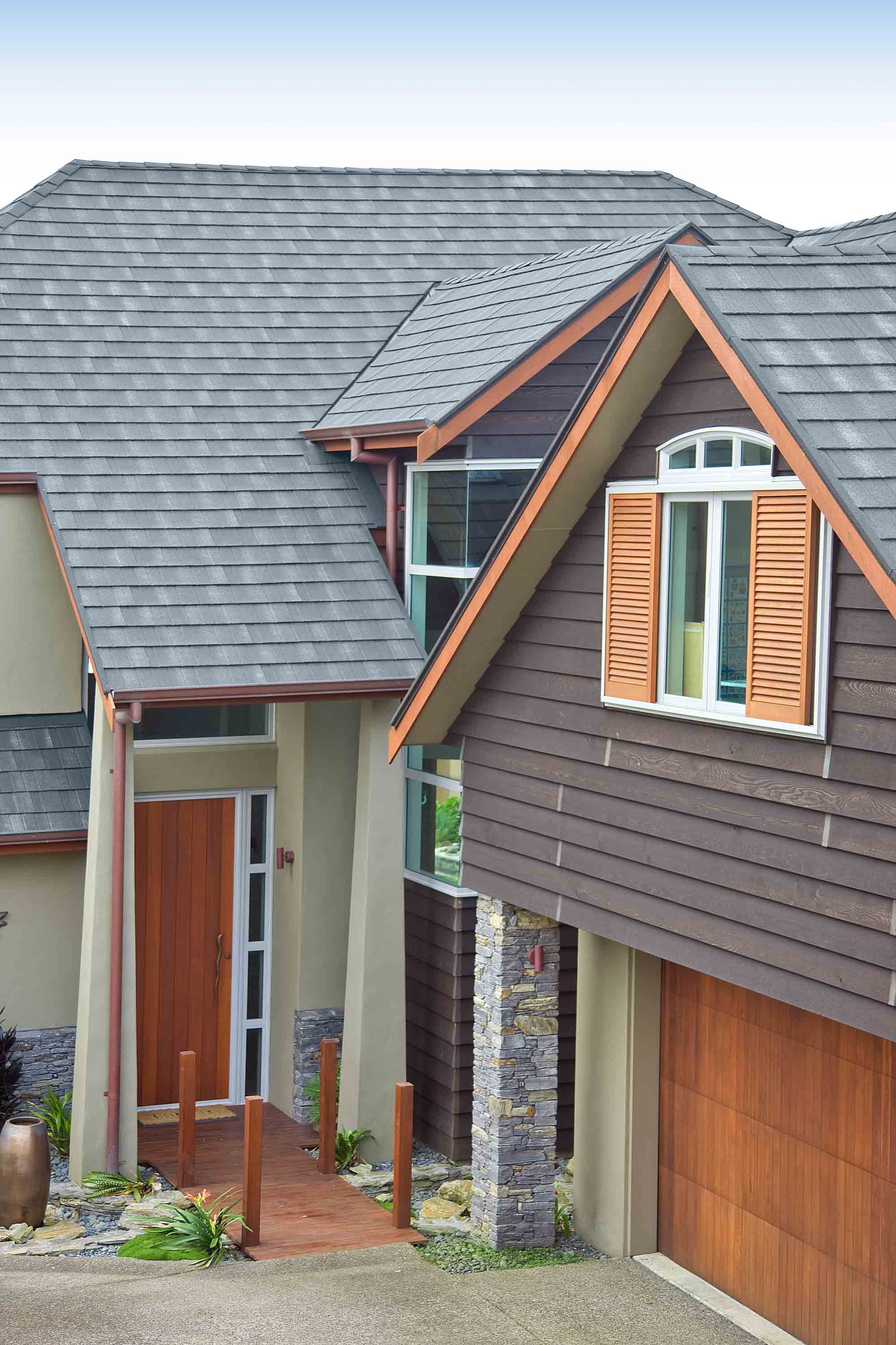 Entrance of a home with a CF Slate metal roof.
